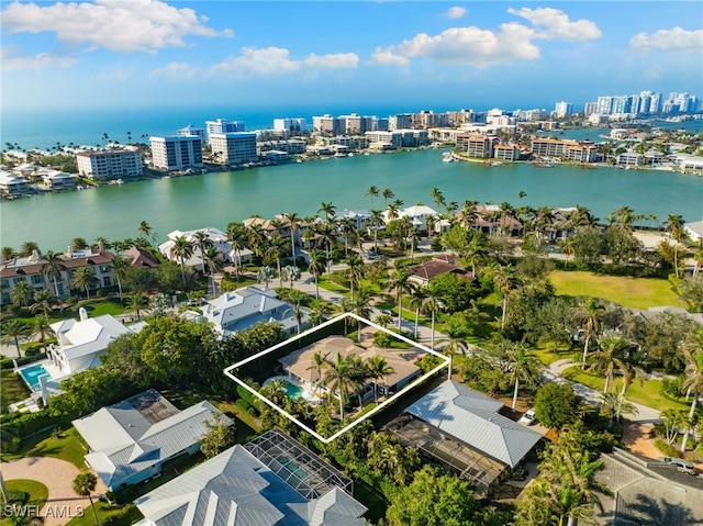 birds eye view of property featuring a view of city, a residential view, and a water view