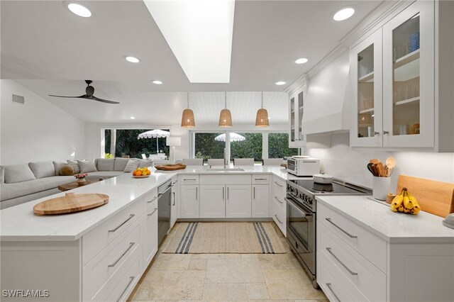 kitchen featuring white cabinetry, stainless steel appliances, light stone countertops, decorative light fixtures, and custom exhaust hood