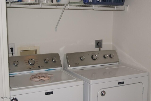 washroom with independent washer and dryer