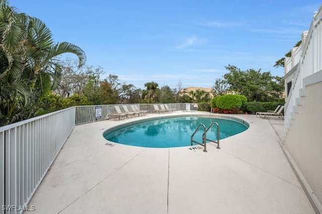 view of pool featuring a patio