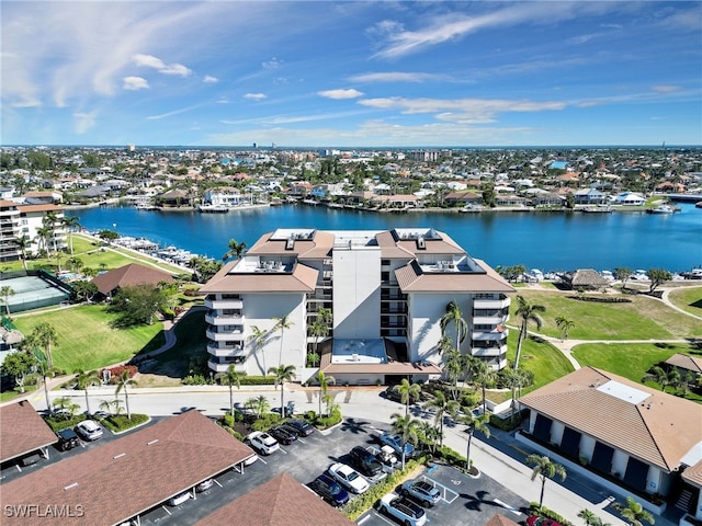 bird's eye view with a water view and a residential view