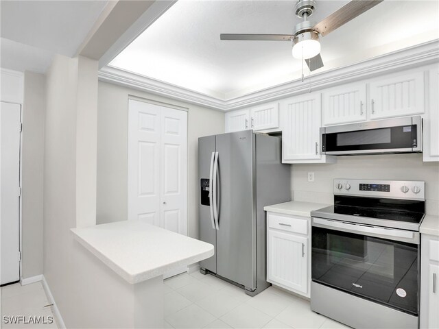 kitchen with stainless steel appliances, white cabinetry, light tile patterned floors, and ceiling fan