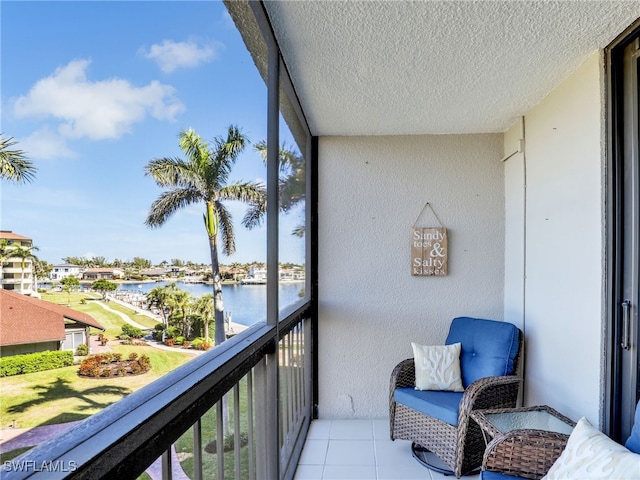 balcony featuring a water view