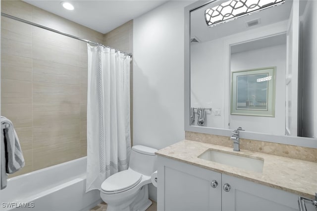 full bathroom with vanity, shower / bath combo, and toilet