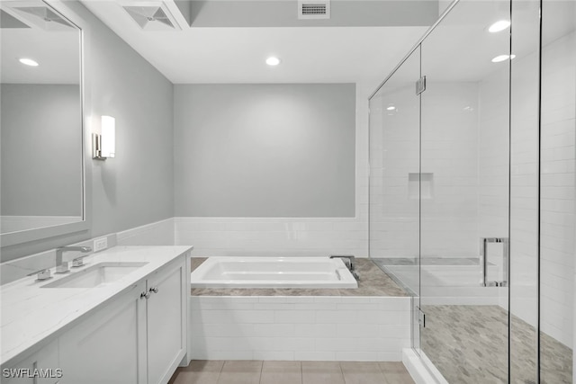 bathroom with vanity, shower with separate bathtub, and tile patterned floors