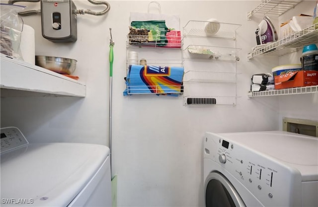 laundry area with washing machine and dryer