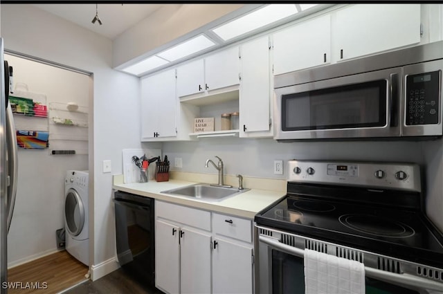 kitchen with sink, white cabinetry, stainless steel appliances, dark hardwood / wood-style flooring, and washer / dryer