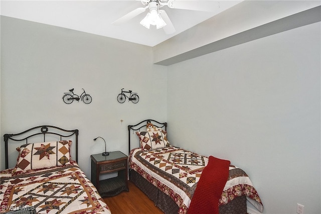 bedroom with wood-type flooring and ceiling fan