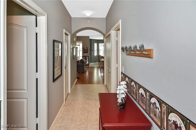 corridor with light tile patterned floors