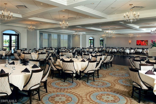 dining space with a notable chandelier, coffered ceiling, french doors, beam ceiling, and crown molding