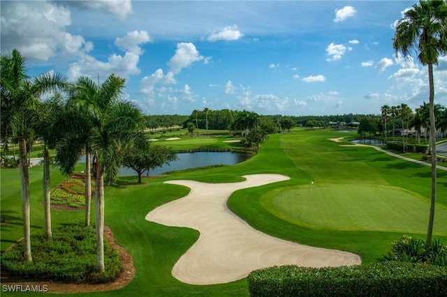 view of property's community with view of golf course and a water view