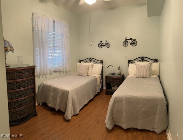 bedroom featuring wood finished floors