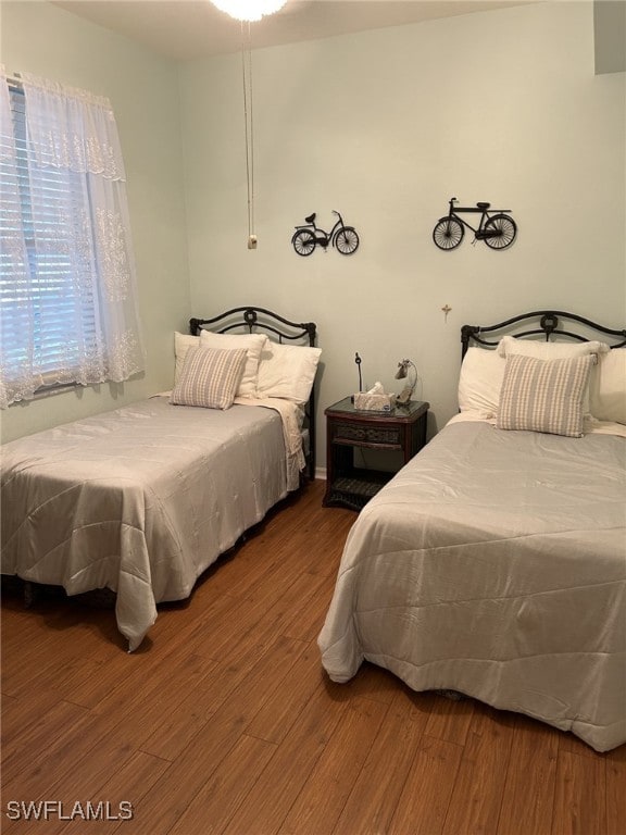 bedroom with wood finished floors