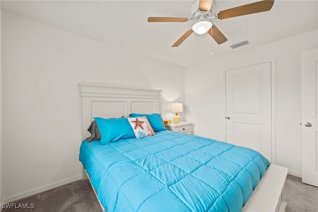 bedroom featuring ceiling fan and carpet