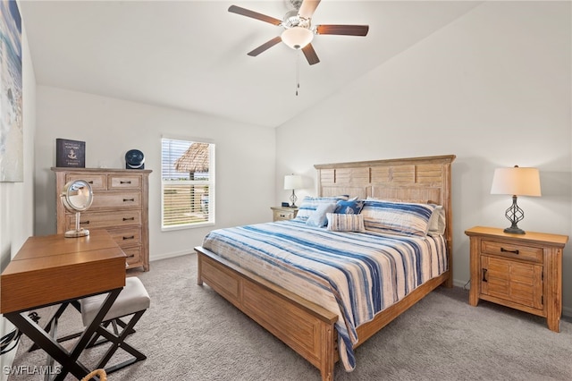 bedroom featuring ceiling fan, vaulted ceiling, and light carpet