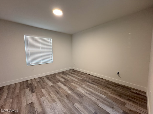 spare room featuring hardwood / wood-style flooring