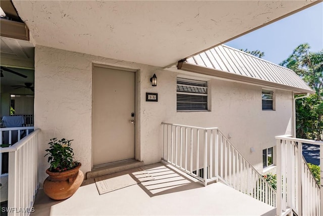 entrance to property with a balcony