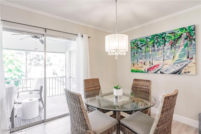 dining space with crown molding and ceiling fan with notable chandelier