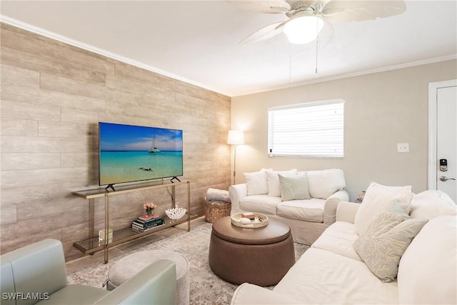 living room with crown molding and ceiling fan