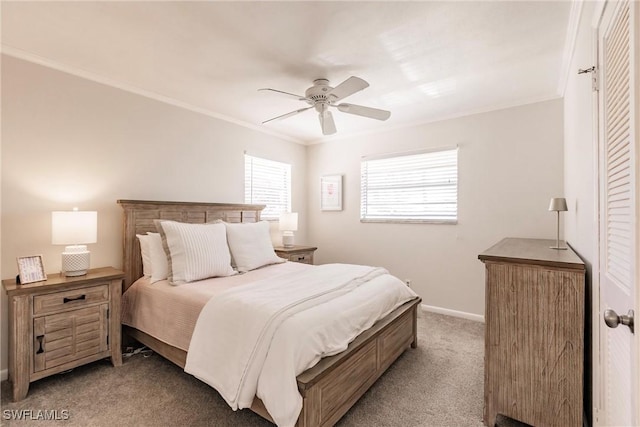 carpeted bedroom featuring ceiling fan and ornamental molding