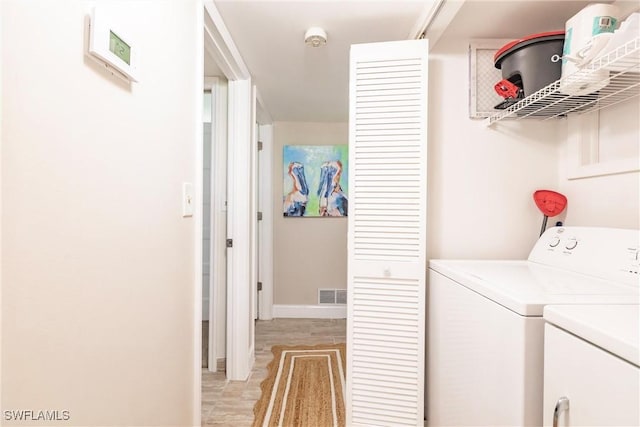 laundry area with separate washer and dryer