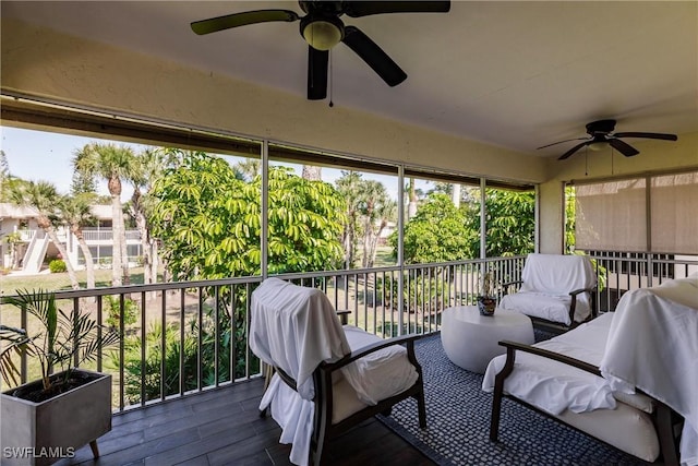 sunroom featuring ceiling fan