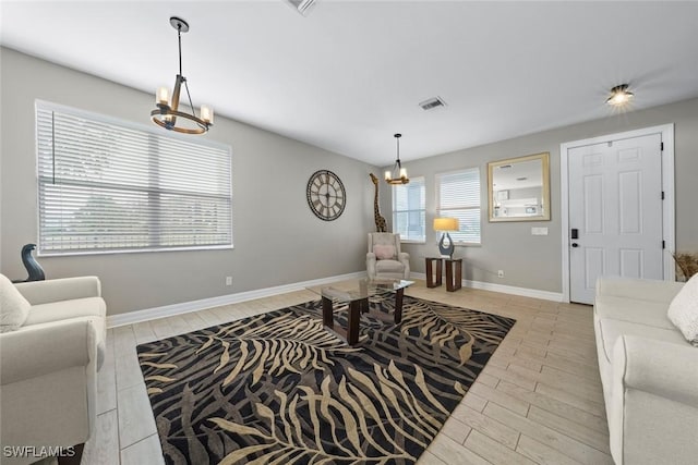 living room with a notable chandelier