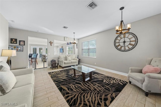 living room featuring an inviting chandelier