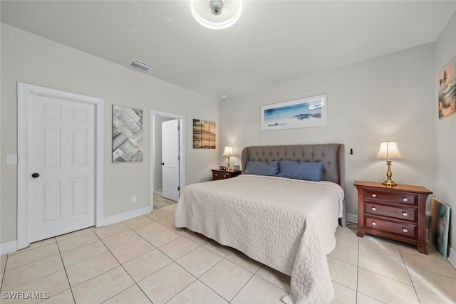 bedroom with light tile patterned flooring