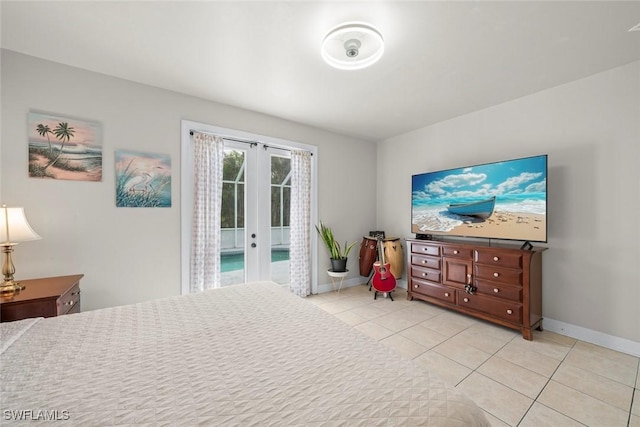 bedroom with access to outside, french doors, and light tile patterned flooring