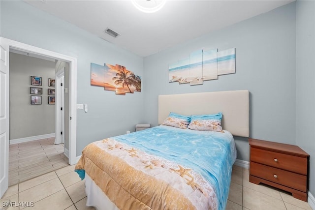 bedroom with light tile patterned flooring