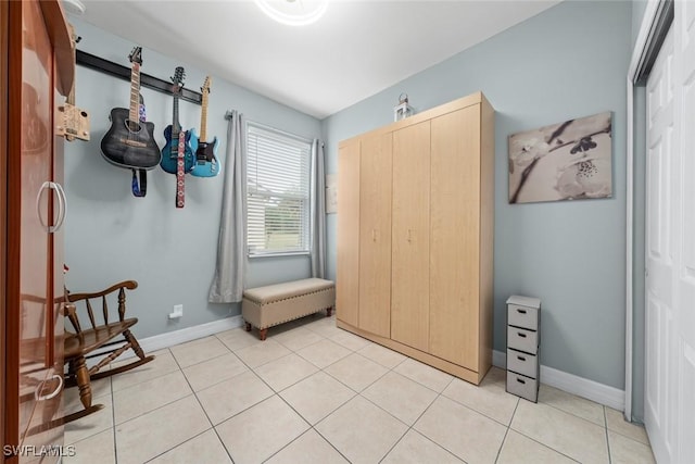 bedroom featuring light tile patterned floors