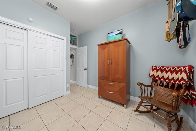 sitting room with light tile patterned floors