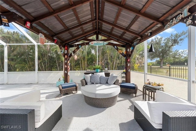 view of patio / terrace featuring an outdoor living space, a gazebo, and a lanai