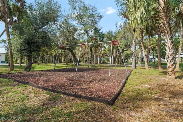 view of playground featuring a lawn