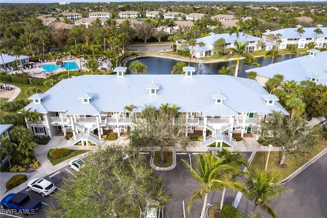 birds eye view of property featuring a water view