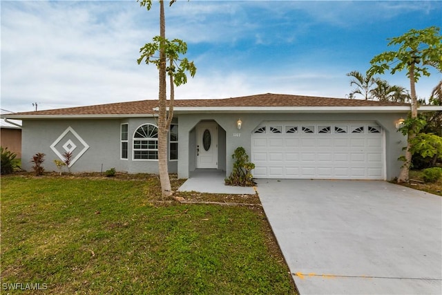 ranch-style home with a garage and a front lawn