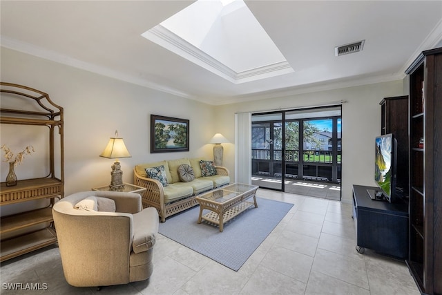 living room with light tile patterned floors, a skylight, and ornamental molding