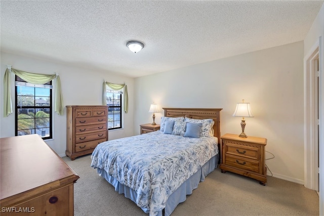 carpeted bedroom with a textured ceiling