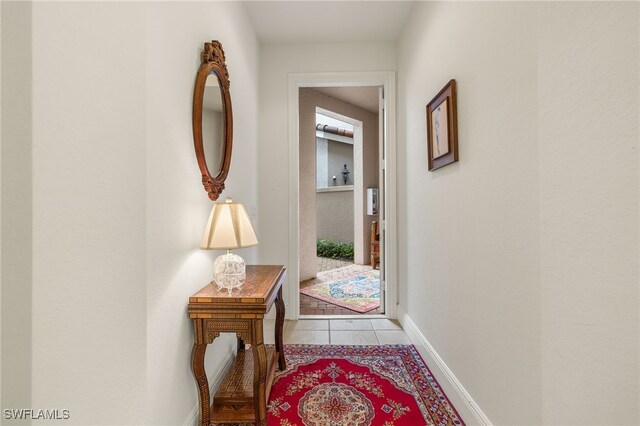 hallway featuring light tile patterned floors