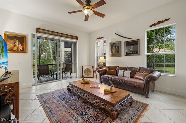 tiled living room with ceiling fan