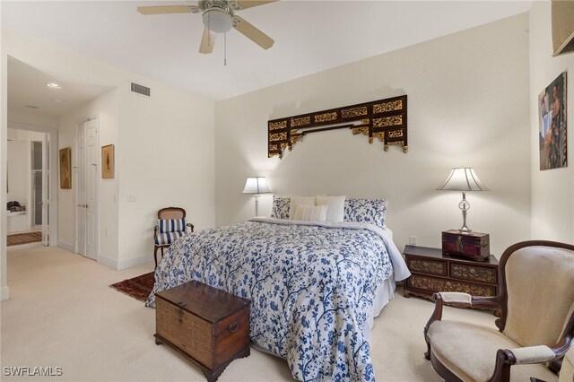 bedroom with ceiling fan and light colored carpet