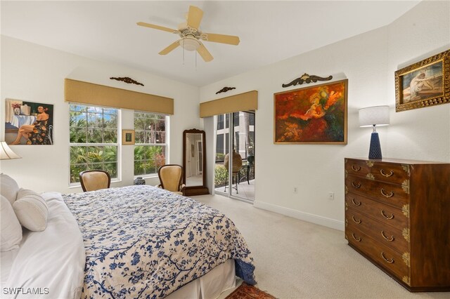 bedroom featuring light carpet, access to exterior, and ceiling fan