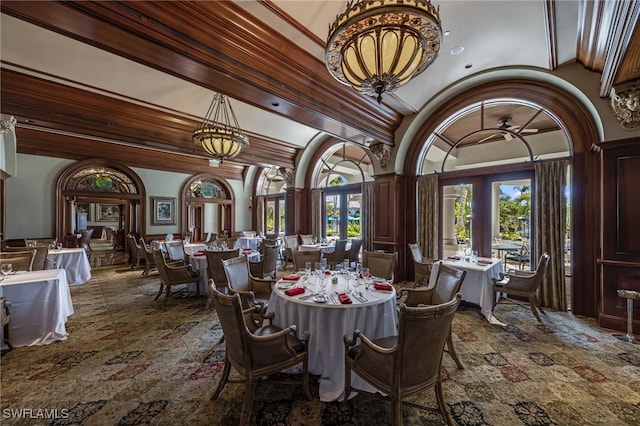 dining room featuring french doors and vaulted ceiling