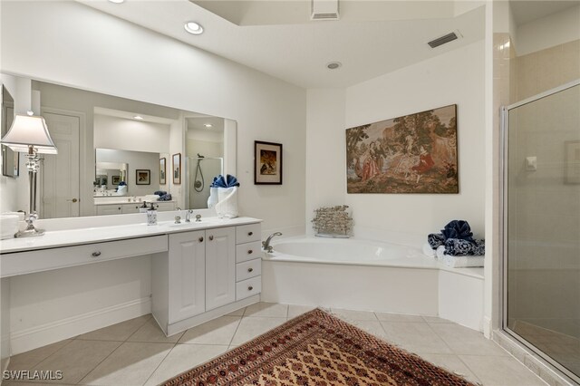 bathroom with tile patterned flooring, vanity, and independent shower and bath