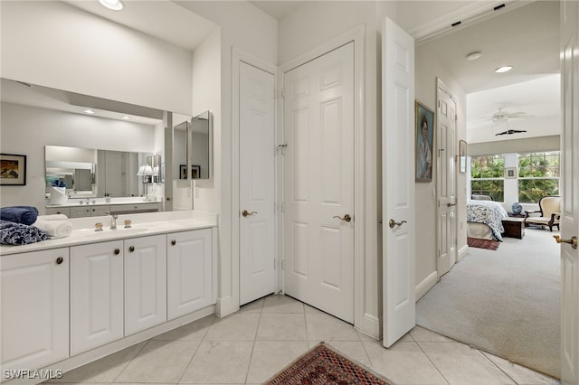 bathroom featuring ceiling fan, tile patterned flooring, recessed lighting, vanity, and ensuite bath