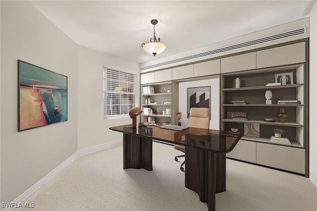 home office with light colored carpet and baseboards