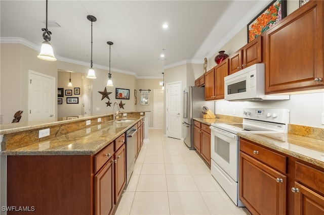 kitchen featuring appliances with stainless steel finishes, sink, hanging light fixtures, and light stone countertops