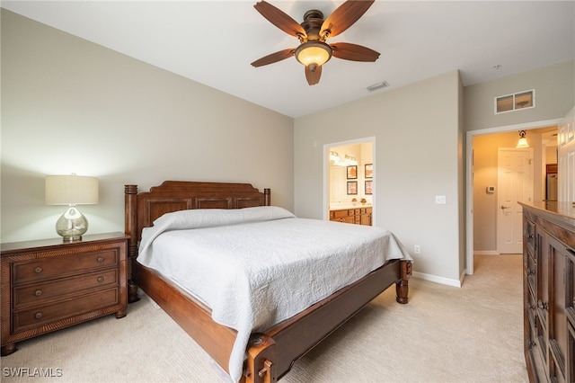 carpeted bedroom featuring connected bathroom and ceiling fan