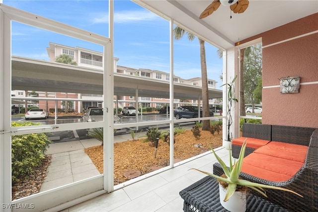 sunroom / solarium with ceiling fan